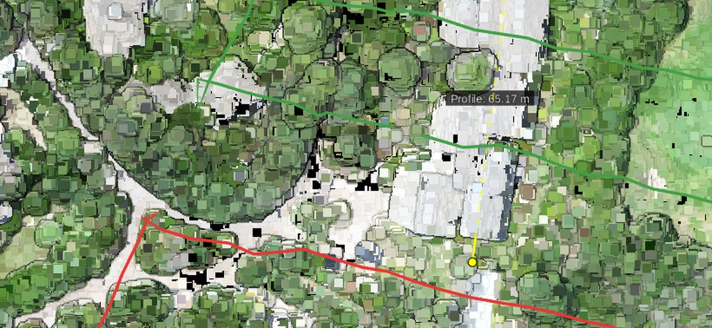 Flight lines over a point cloud, green where they align and red where one is misaligned