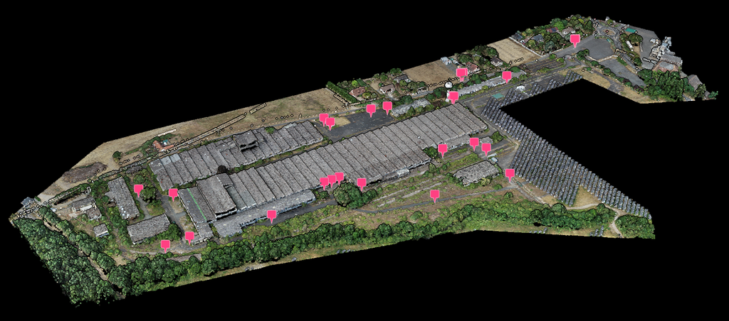 Point cloud of an industrial site with pink ground control point markers