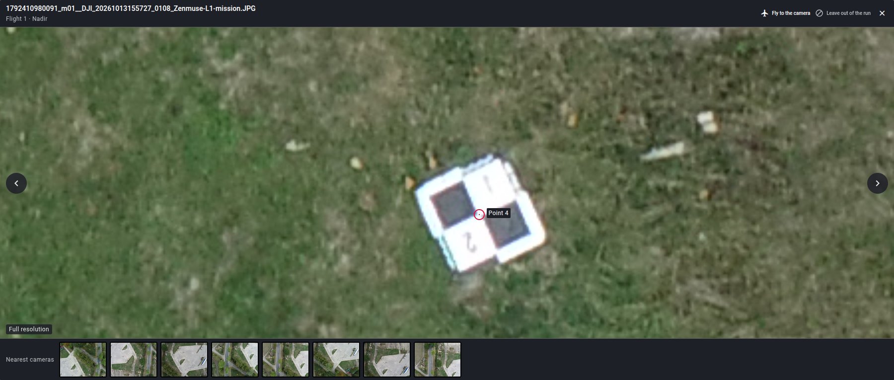 A ground control target marked as Point 4 in a full resolution drone photo, with the nearest cameras below