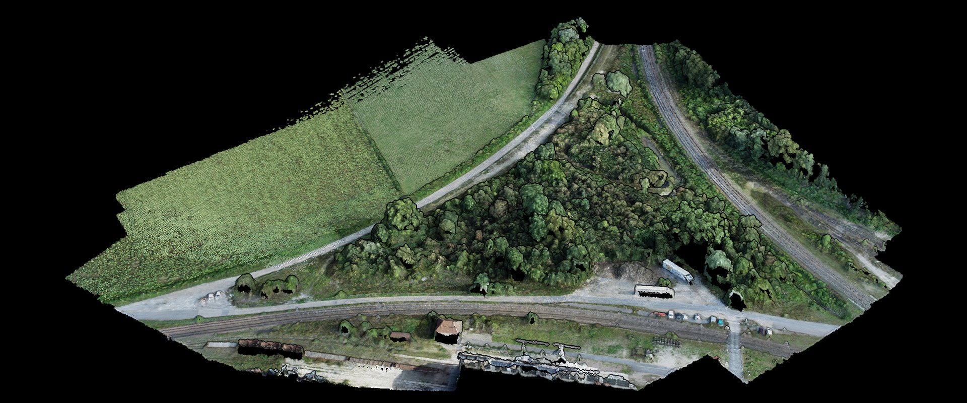 A coloured point cloud built from 146 drone photos of one flight: fields, woodland, roads and a railway